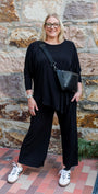 Slope Asymmetric Foundation Jersey Women's Tunic with a scoop neckline in black.
