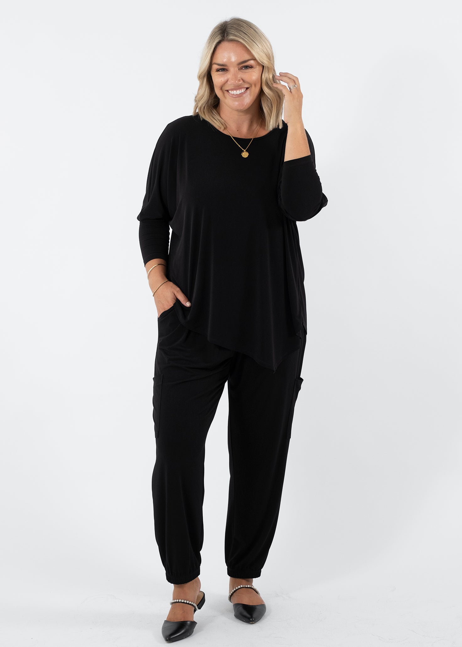 Slope Asymmetric Foundation Jersey Women's Tunic with a scoop neckline in black.