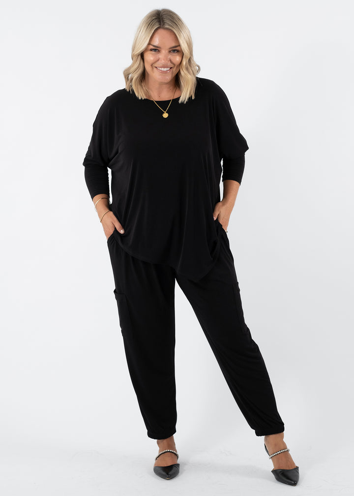 Slope Asymmetric Foundation Jersey Women's Tunic with a scoop neckline in black.