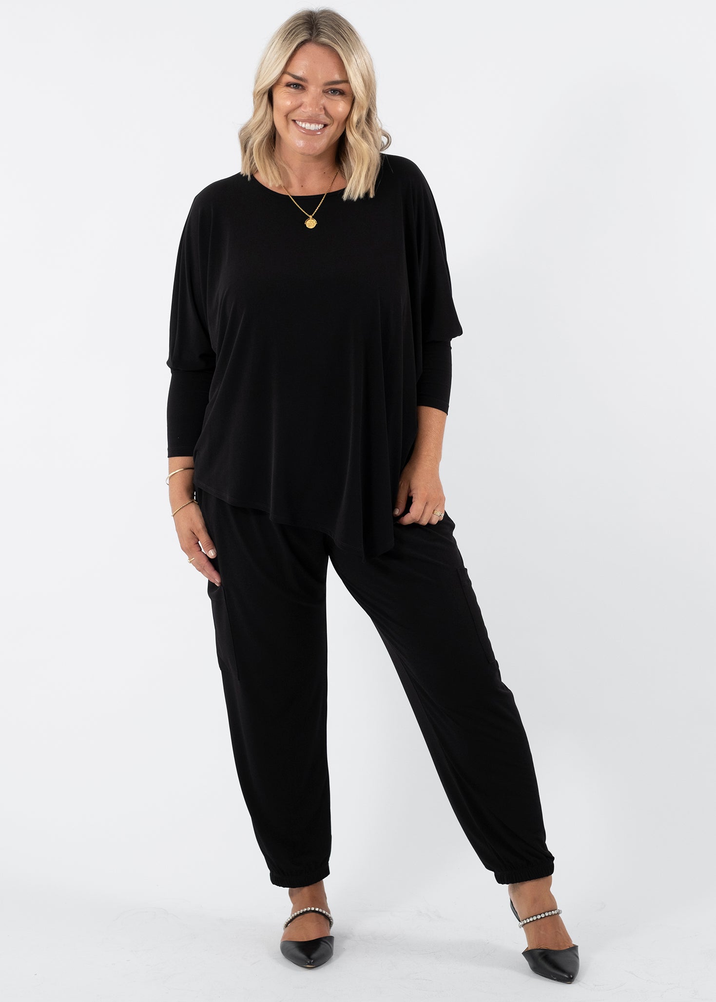 Slope Asymmetric Foundation Jersey Women's Tunic with a scoop neckline in black.
