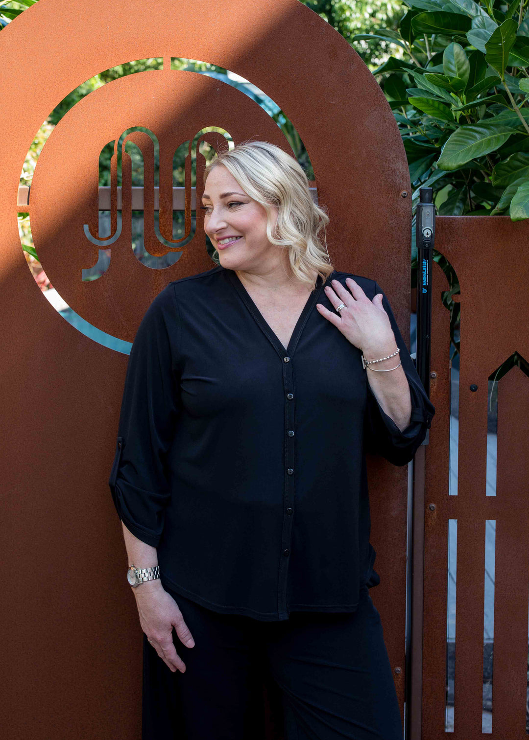 Uber Foundation Jersey Women's Button-down Blouse with a v-neckline in black.