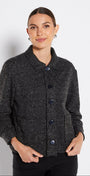 Woman wearing a dark gray textured jacket on a white background