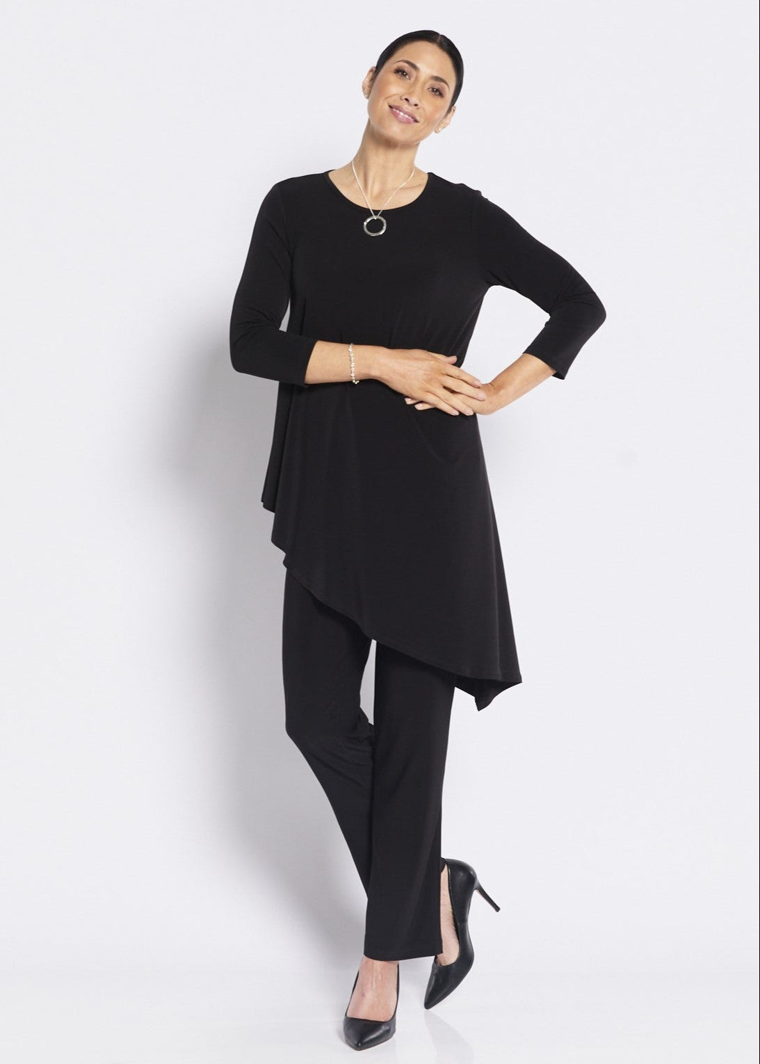 Woman wearing a black outfit on a white background