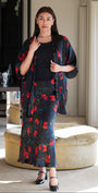 Woman wearing a floral outfit in an indoor setting