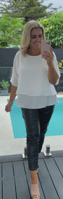 Video of model wearing ivory layered shirt