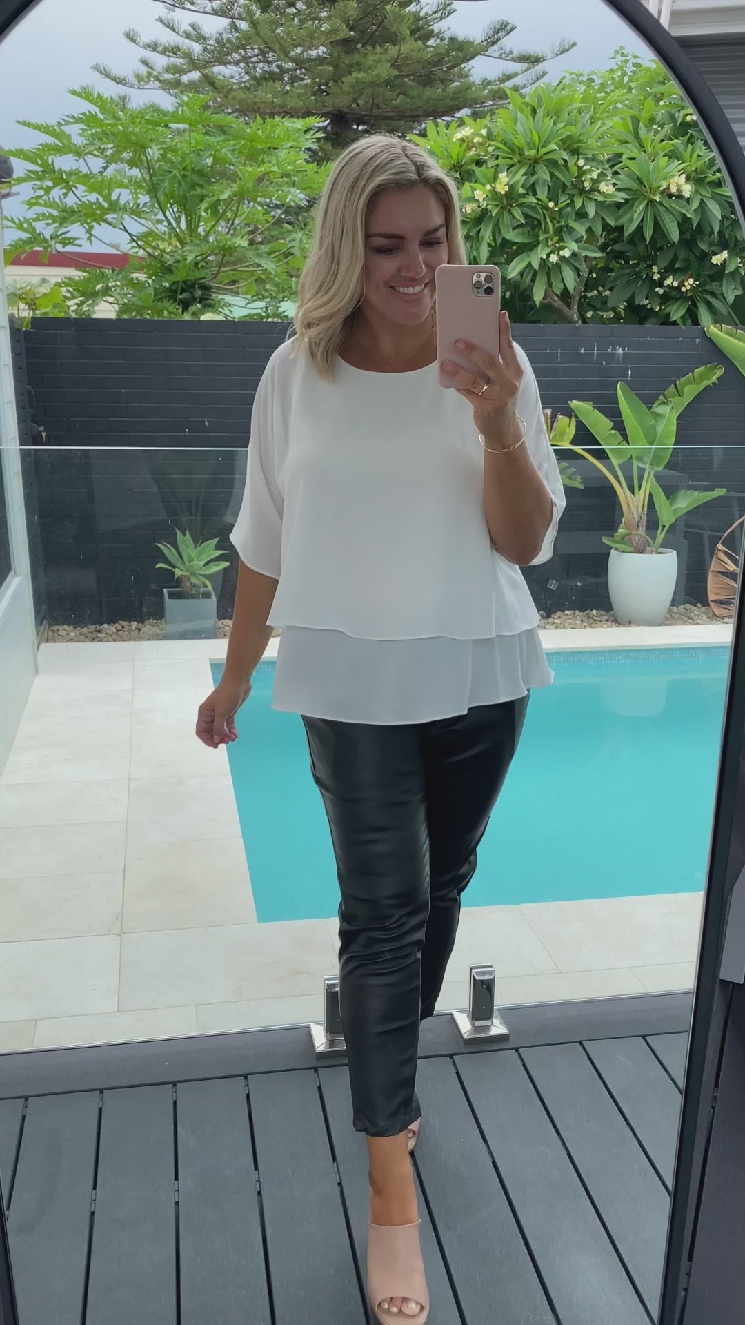 Video of model wearing ivory layered shirt