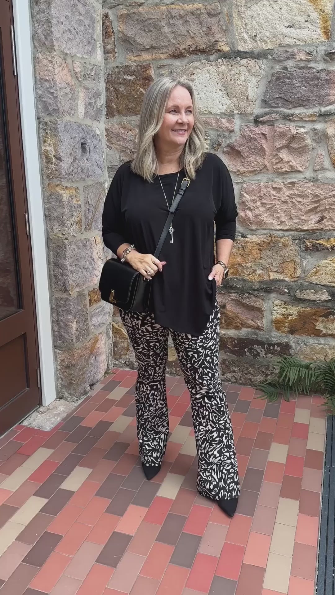 Slope Asymmetric Foundation Jersey Women's Tunic with a scoop neckline in black.