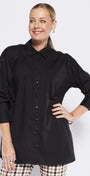 Woman wearing a black shirt and plaid pants on a white background