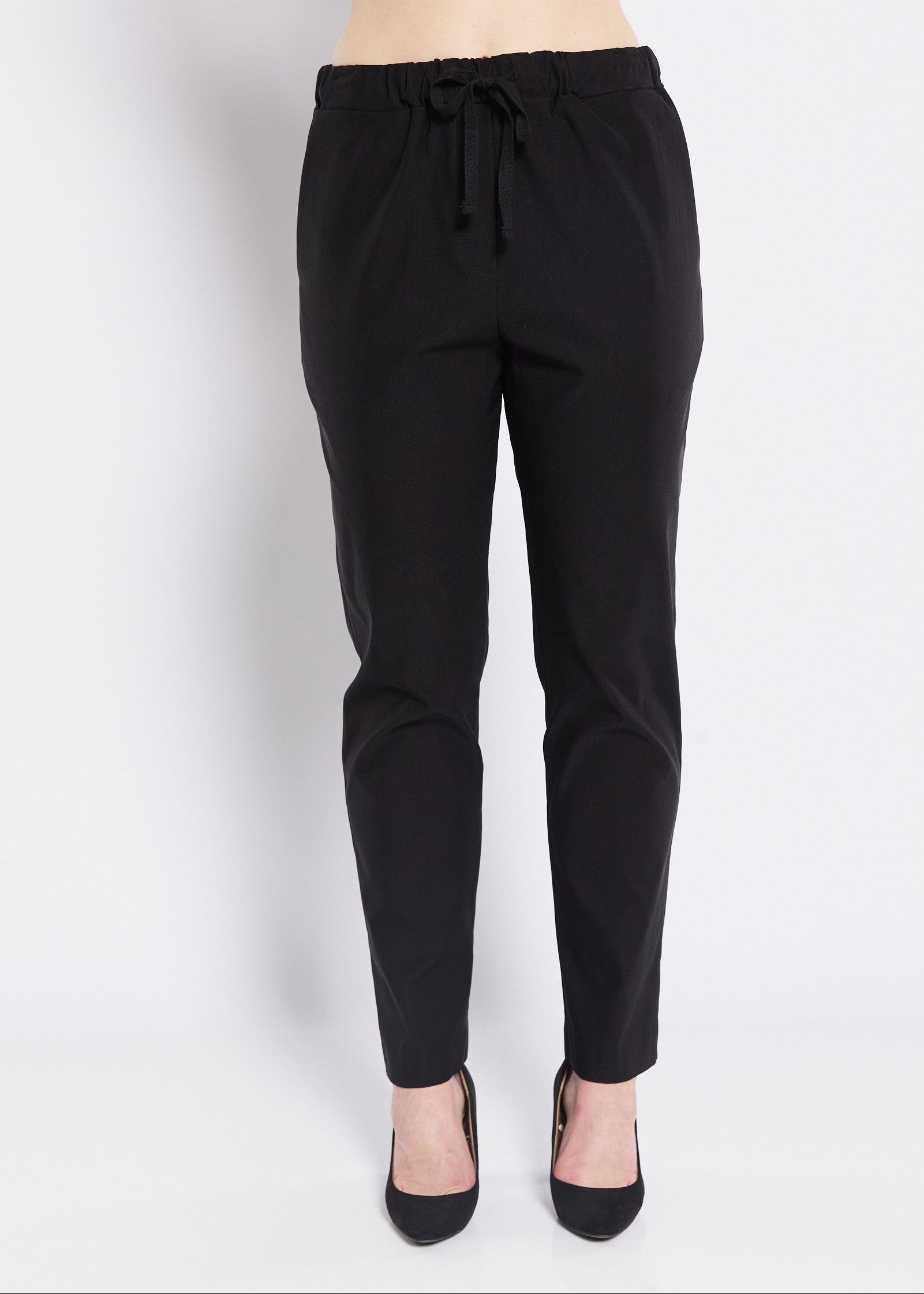 Black pants with drawstring waist on a white background
