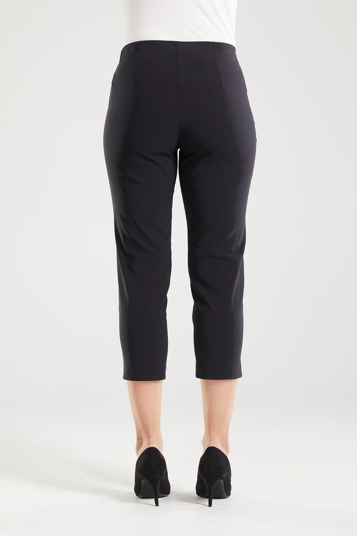 Adora is a Spring Summer 3/4 cropped black pant. Cut at calf length, with an easy comfortable pull on elastic waist and slim legs. Image is back view of model. Philosophy Australia bengaline 3/4 length pant.
