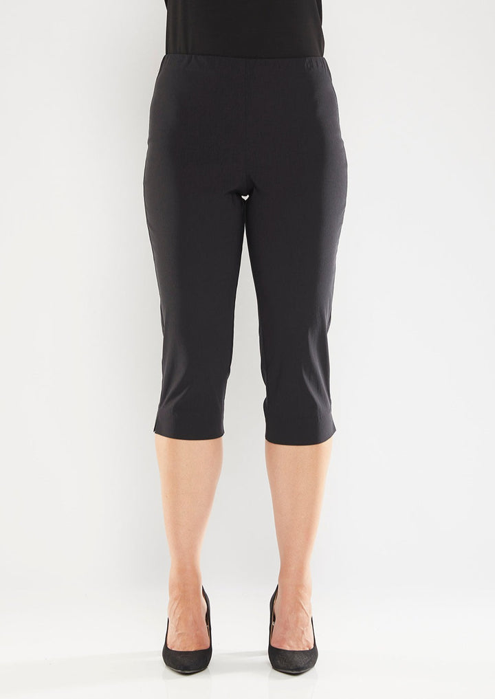 The black Capri feature a below the knee-length pull on style, elasticated waist and slim cut leg. Image is model is standing front forward. Philosophy Australia bengaline knee length pant.